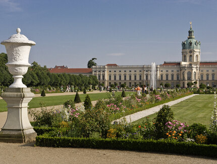 Walkers in the summery park of Charlottenburg Palace