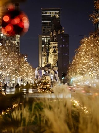 The Christmassy illuminated Kurfürstendamm in Berlin with the Memorial Church 