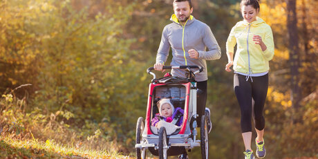 A young family jogging