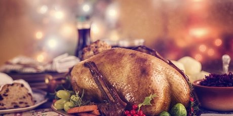 Christmas goose goose roast on festively arranged table 
