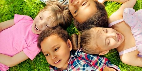 High angle view of children lying in a park