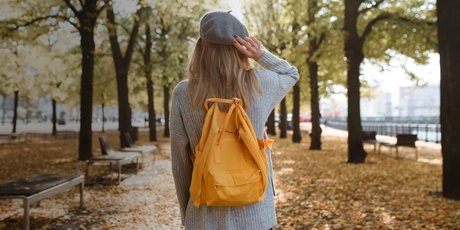 A young woman on a walk in autumn in Berlin 