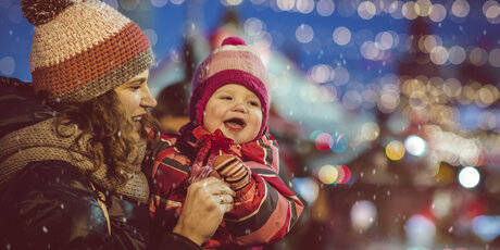 Mother and baby at the Christmas market