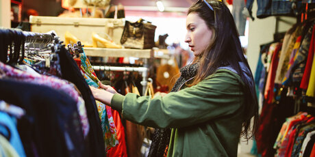 A girl is shopping vintage and second hand clothes