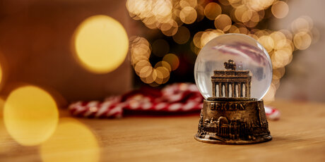 Atmospheric Christmas decoration with a snow globe of the Brandenburg Gate