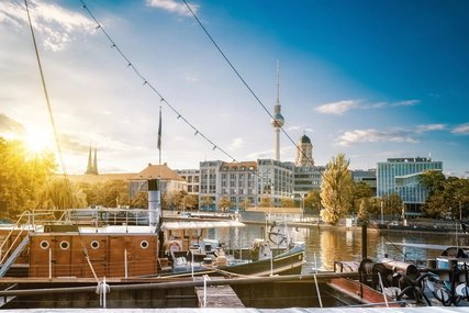 old fishermans boats in berlin with view on tv-tower