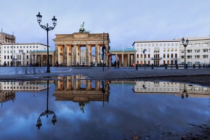 Berlin, Brandenburg gate with reflection in a puddle