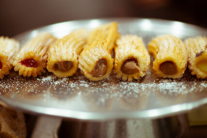 Filled Churros with icing sugar