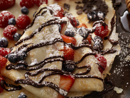 Crepes with Fresh Berries, Chocolate Sauce and Powdered sugar