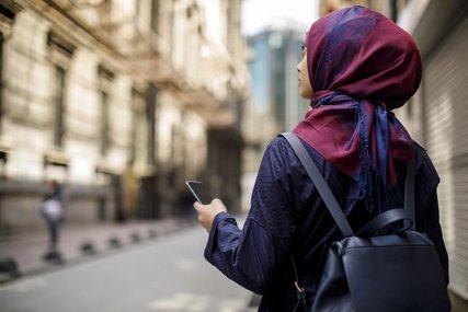 Muslim tourist exploring city