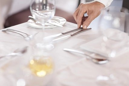 Restaurant staff setting tables