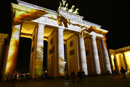 Golden illuminated Brandenburger Gate at Festival of Lights