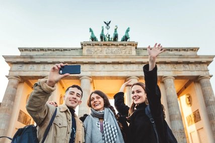 Friends at Brandeburg Gate in Berlin take a selfie