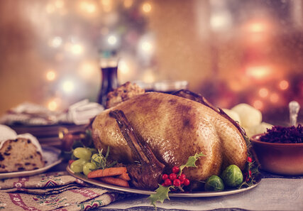 Christmas goose goose roast on festively arranged table 