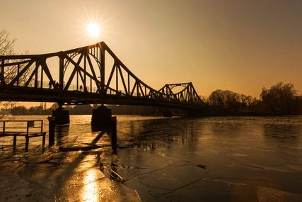 The Glienicke Bridge (German: Glienicker Brücke) between Berlin and Potsdam at sunset