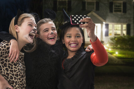 Three friends doing a Selfie on Halloween