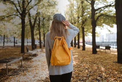 A young woman on a walk in autumn in Berlin 