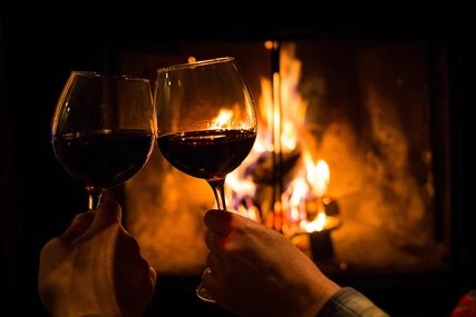 Wine glasses in front of a fire Wine glasses in front of a fire