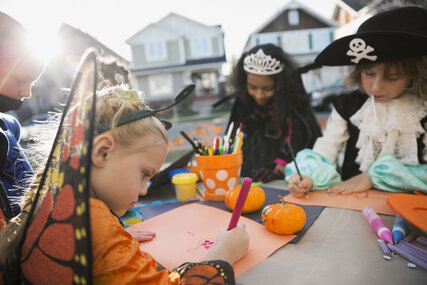 Disguised children paint on Halloween