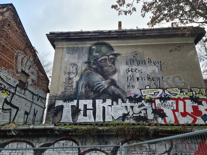 Street art in Friedrichshain: "Monkey See. Monkey Do." Mural by Herakut