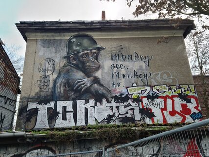 Street art in Friedrichshain: "Monkey See. Monkey Do." Mural by Herakut