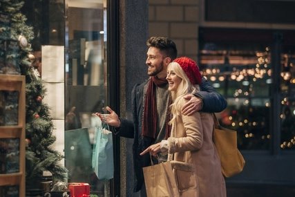 Couple Doing Some Window Shopping Couple Doing Some Window Shopping in Berlin in Winter