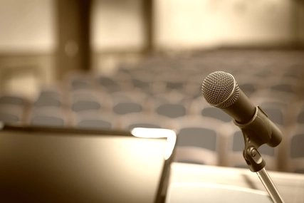 Rostrum with microphone and computer in conference room