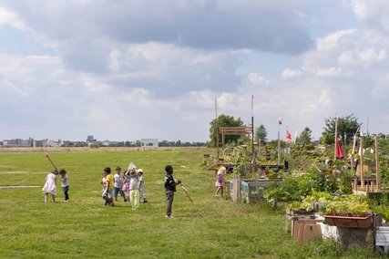 Children playing at Tempelhof Fieldin summer time Children playing at Tempelhof Fieldin summer time