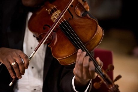 Midsection Of Man Playing Violin