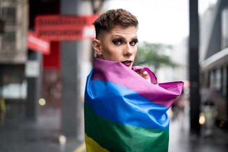 Confident Gay Boy Holding Rainbow Flag