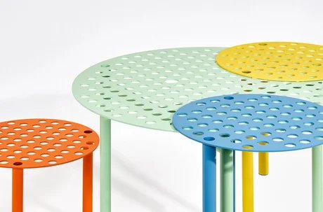 A Bunch of Holes, a table and three stools