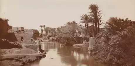 Bahr Yusuf in Medinet el-Fayum (Ägypten), links am Ufer sitzend Georg Schweinfurth, der Heinrich Schliemann und Rudolf Virchow 1888 auf ihrer Reise im Fayum begleitete.