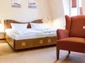 Komfortables Doppelzimmer mit gemütlicher Sitzgruppe