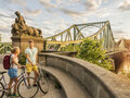Bicycle tour man and woman near Glienicke Bridge in Berlin