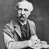 Edward W. Godwin mit Skizzenbuch in der Hand um 1880