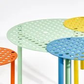 A Bunch of Holes, a table and three stools