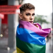Confident Gay Boy Holding Rainbow Flag