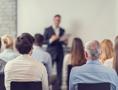 Business people attending a seminar.
