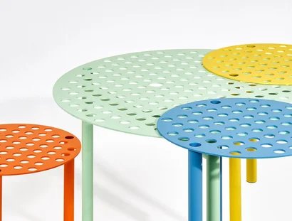 A Bunch of Holes, a table and three stools