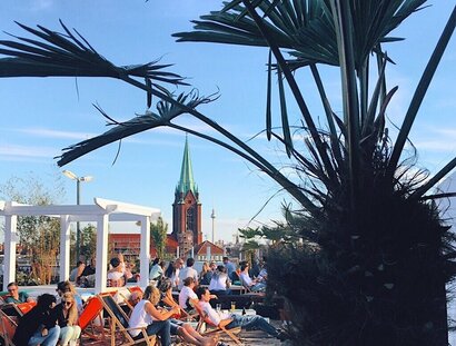 Stylish Beach Club on the roof of the carpark on a shopping center in Prenzlauer Berg in Berlin