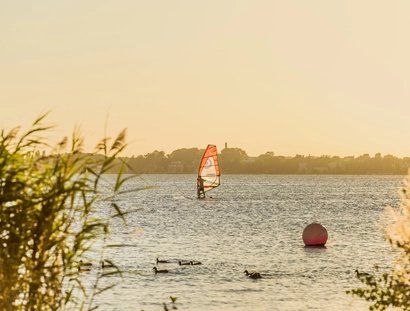 A surfer on the Großer Müggelsee in Berlin, a popular destination
