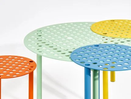 A Bunch of Holes, a table and three stools