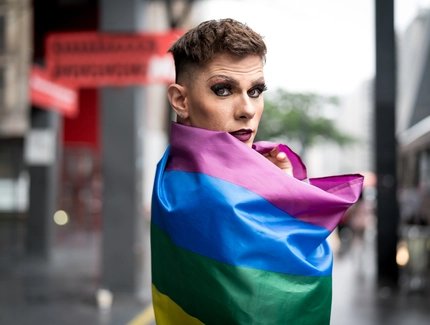 Confident Gay Boy Holding Rainbow Flag