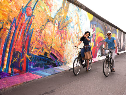 Cycling tour at the East Side Gallery in Berlin