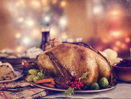 Christmas goose goose roast on festively arranged table 