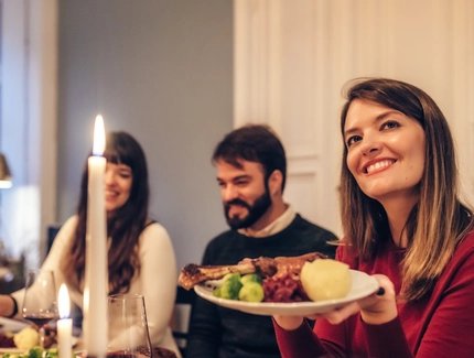 Group of friends eating a goose 