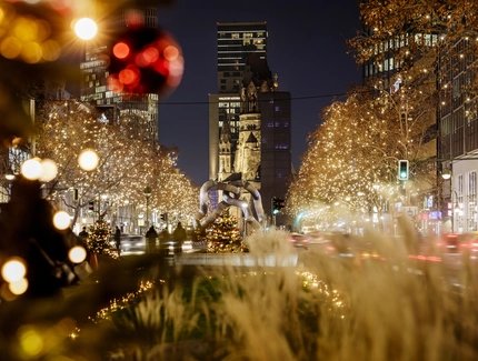 The Christmassy illuminated Kurfürstendamm in Berlin with the Memorial Church 