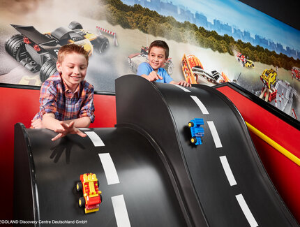 LEGOLAND Discovery Center - Two boys blaying with small Match Cars