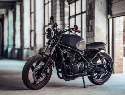 Black motorbike in a garage