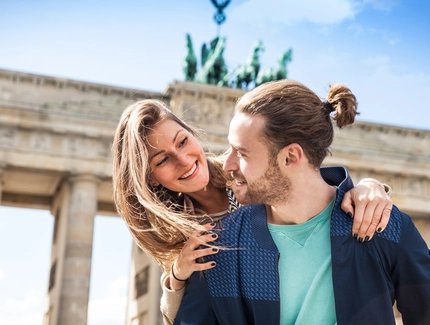 Beautiful couple celebrating in Berlin - Brandenburg Gate